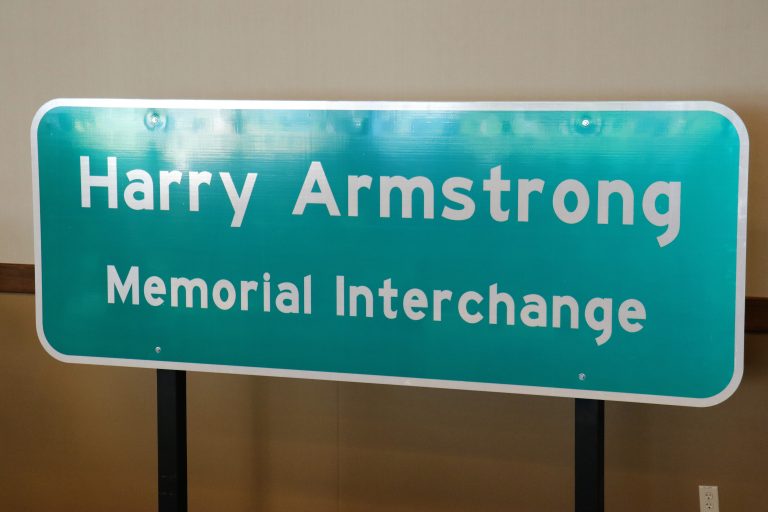 City installs Harry Armstrong Memorial Interchange signs