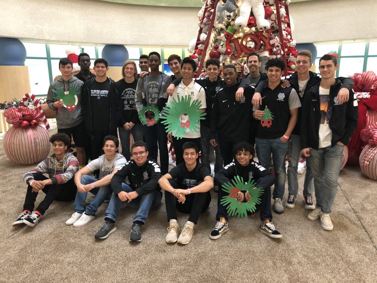 Clovis North student-athletes spread holiday cheer to Valley Children’s patients