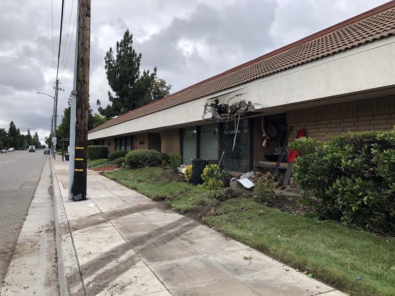 City of Clovis street sweeper crashes into a building after collision