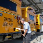 Clovis Unified bus driver Guy Foell plugs in the charger